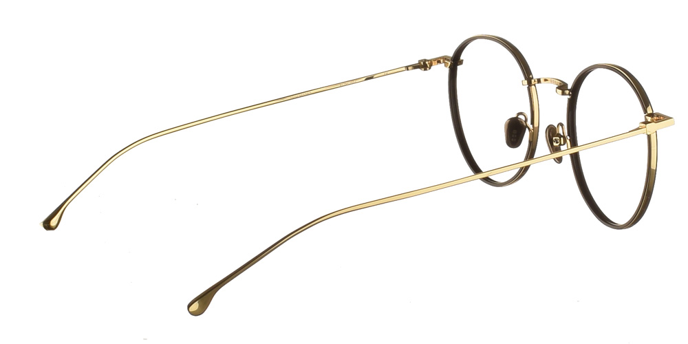 Στρογγυλά  χρυσά μεταλλικά ανδρικά και γυναικεία γυαλιά οράσεως Dean Gold Black με μαύρες κοκάλινες λεπτομέρειες  της εταιρίας Komono κατάλληλο για όλα πρόσωπα.