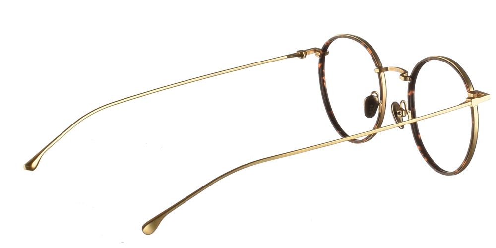 Στρογγυλά  χρυσά μεταλλικά ανδρικά και γυναικεία γυαλιά οράσεως Dean Gold Tortoise με καφέ ταρταρούγα κοκάλινες λεπτομέρειες  της εταιρίας Komono κατάλληλο για όλα πρόσωπα.